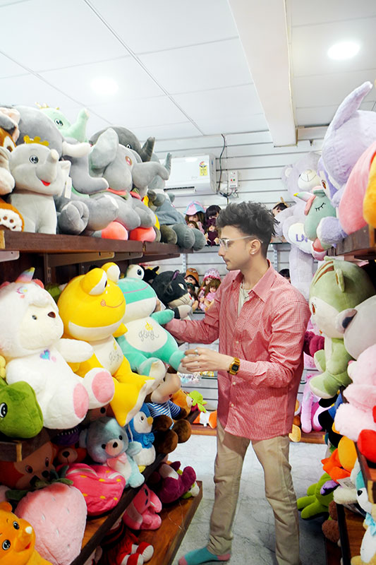 Smart handsome boy 2026 shopping for soft toys showing stylish and cool Indian boy look.